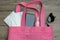 Shopping bag with must have items smart phone, protective face mask, glasses and sanitizer gel, corona virus or Covid-19