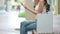 Shopping bag placed on a wooden seat with  shoppers are searching for information with smartphones on background