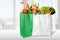 Shopping bags with grocery products on light