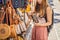 Shopping on Bali. Young woman chooses Famous Balinese rattan eco bags in a local souvenir market in Bali, Indonesia