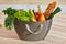 a shopping basket on sunlit kitchen countertop  full of tasty fresh food