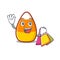 Shopping candy corn cartoon with character shape