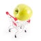 Shopping cart with big green apple on white. Buying fruits from supermarket. Self-service supermarket full shopping trolley cart.