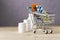 Shopping cart with different tablets and various pill bottle