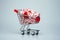 Shopping cart full of Christmas cane candies. Supermarket trolley with decoration, winter holidays. New Year sale minimal concept