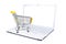 Shopping cart on keyboard of blank screen white laptop isolated on white. Electronic commerce concept