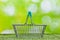 Shopping cart on nature background, Creative, Concept, Responsible shopping with care for the environment