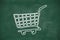 Shopping cart symbol on black blackboard