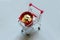 Shopping cart or trolley fill with red pile of coins on grey background.Business and finance concept.