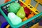 Shopping cart trolley full of giant fruits and vegetables