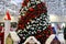 Shopping center with a Christmas tree decorated with beautiful balls, New Year`s toys, holiday decorations, winter holiday