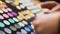 Shopping mall customer making eyeshadow swatches hand, beauty products, make-up