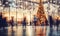 A shopping mall decorated for christmas with a large illuminated Christmas tree and busy shoppers