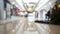 Shopping mall with defocused walking peoples