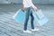 Shopping man urban consumerism bags legs jeans