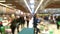 Shopping in modern supermarket. Abstract blurred motion of customers in food and grocery store, and defocused interior