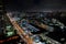 Shopping plaza strip mall night aerial photo