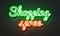 Shopping spree neon sign on brick wall background.
