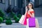 Shopping and tourism concept. Beautiful girl with shopping bags. Shopaholic. sale and discount. girl online shopping.