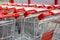 Shopping trolleys near large shopping center. Rows of basket baskets