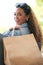 Shopping, woman and happy customer portrait with eco paper bag for a sale, promotion or discount. Person with smile for