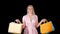 Shopping woman happy smiling holding shopping bags iwhile walking, Alpha Channel