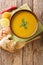 Shorbat Adas Red Lentil Soup closeup in the bowl. Vertical top view