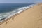 shore with dune slope and Atlantic waves from above at Sandwich Harbour, Namibia