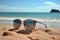 Shore essentials stylish sunglasses resting against a sandy beach backdrop