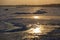 The shore of a frozen sea in winter, ice hummocks at sunset. Landscape of the Azov Sea in winter