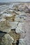 The shore of a hyperhaline lake covered with self-precipitating salt Sodium chloride, California