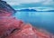 The shore of the Krasnoyarsk reservoir in the evening red stones Mount Tepsei
