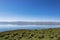 The shore of the lake in the early morning, quiet and windless weather