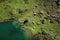 Shore of lake in the mountains of the Pyrenees from above