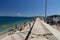 Shore with reef and small beach with bathers in porto santo stefano