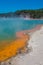 Shore of steaming Wai-O-Tapu sulfur pond, New Zealand