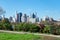 Shoreline of Astoria Queens New York with Plants looking towards the East River and the Manhattan and Roosevelt Island Skyline in