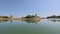 Shoreline of lakeside of Kaptai lake with close up of flora