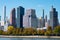 Shoreline of Roosevelt Island with the Midtown Manhattan Skyline in New York City with Colorful Trees during Autumn
