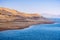 The shoreline of San Luis Reservoir, an artificial lake storing water for agricultural purposes in Central California; visible low