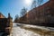 Shores of the Admiralty Canal with remnants of ice on a bright sunny spring day with sunny bunny and blurred background