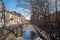 Shores of the Admiralty Canal with remnants of ice on a bright sunny spring day with sunny bunny and blurred background