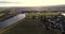 Short clip Drone Flight above Cambuskenneth and Cambuskenneth Abbey towards Springkerse Retail Park Stirling above River Forth low