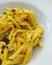 Short cut pasta with creamy sauce, pennette alla carbonara, Italian pasta with egg sauce, creamy egg sauce, classic Italian pasta