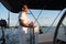 Short-haired confident mature man sailing on a yacht