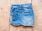 Short jean on wood background