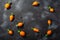 Short Rondo carrots on dark textured background with copy space,  top view