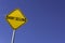 Short Selling - yellow sign with blue sky background