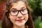 Short sighted teen girl in myopia glasses