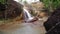 Short Waterfall and river, with big rocks, Daya Baru village of Indonesia